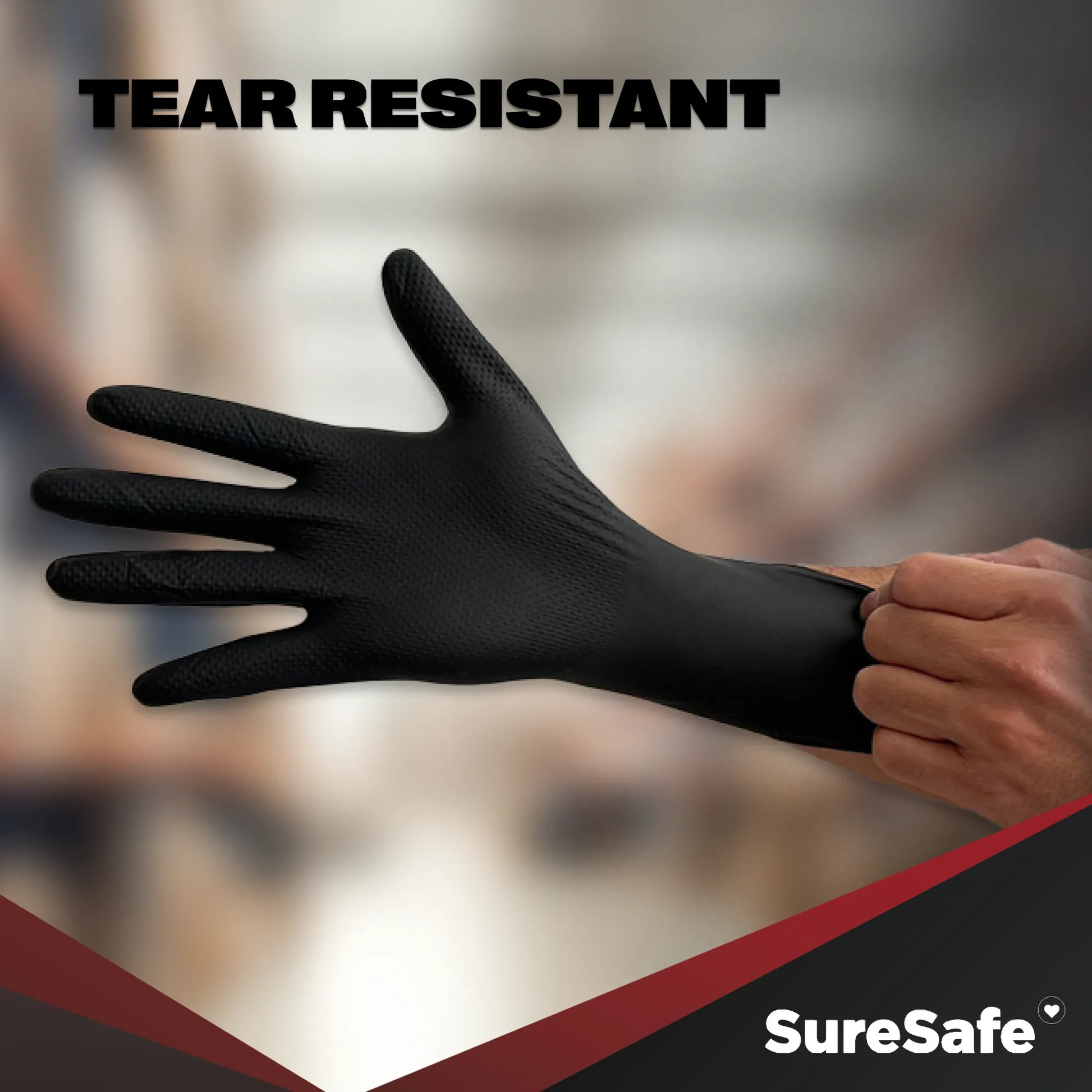 Durable SureSafe IGRIP 8 mil black nitrile gloves being stretched to show maximum tear and abrasion resistance.