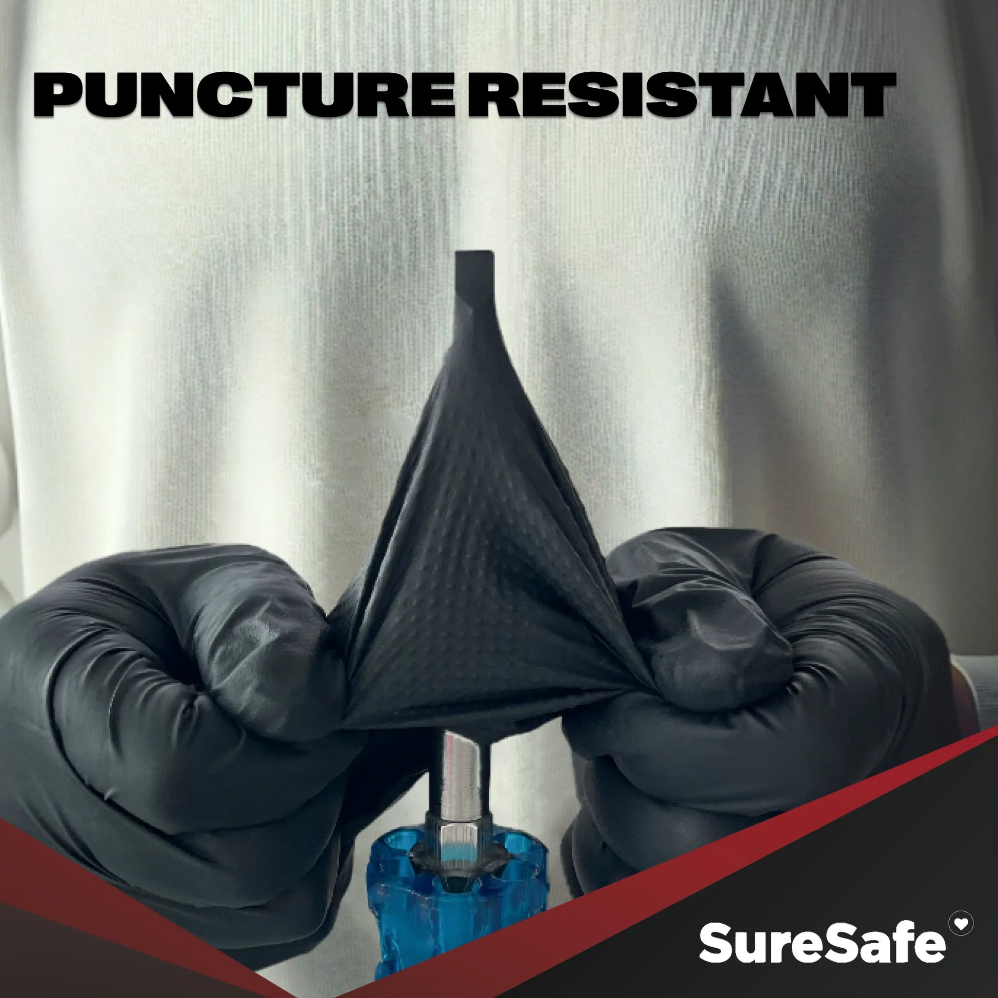 SureSafe IGRIP 8 mil black nitrile gloves being tested for high puncture resistance in demanding industrial environments.