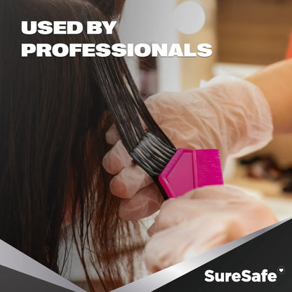 Professional hair stylist using SureSafe LUCID clear vinyl gloves to show visibility and dexterity during styling.