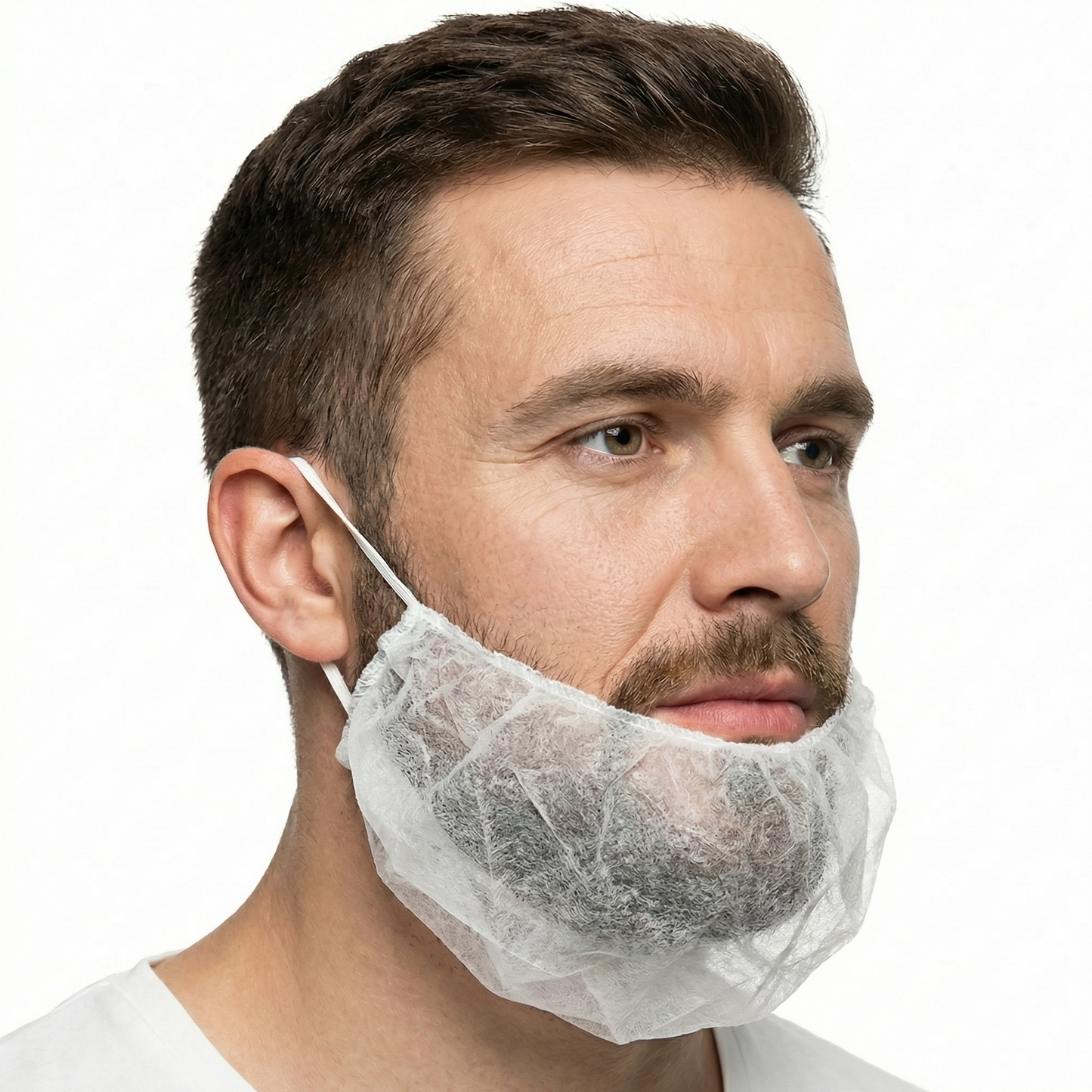 Man wearing a white beard net against a white background