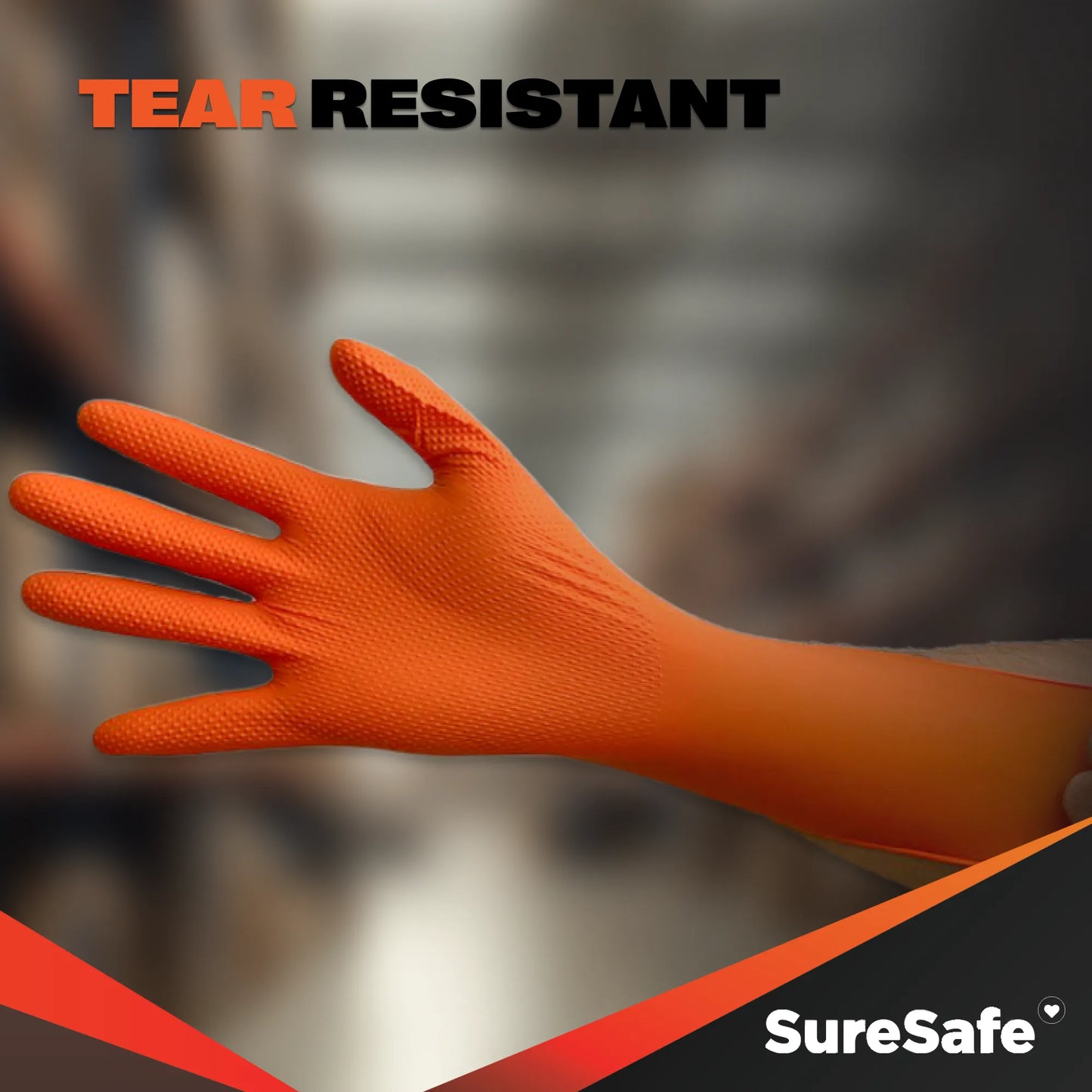 Durable SureSafe IGRIP 8 mil orange nitrile gloves being stretched to demonstrate superior tear and abrasion resistance.