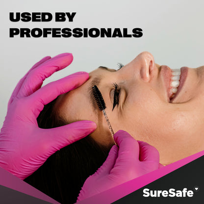 Beauty professional wearing pink SureSafe ROSÉ gloves while performing a facial treatment for a polished look.