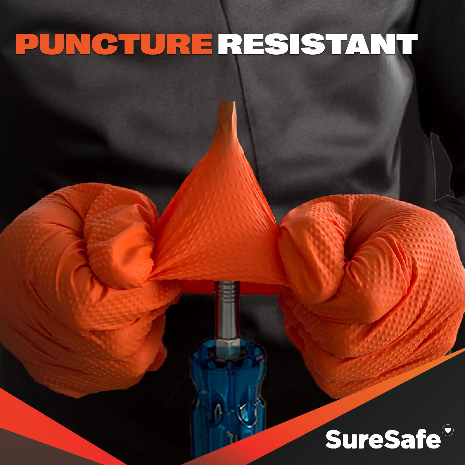 SureSafe IGRIP 8 mil orange nitrile gloves being tested for high puncture resistance in tough industrial environments.