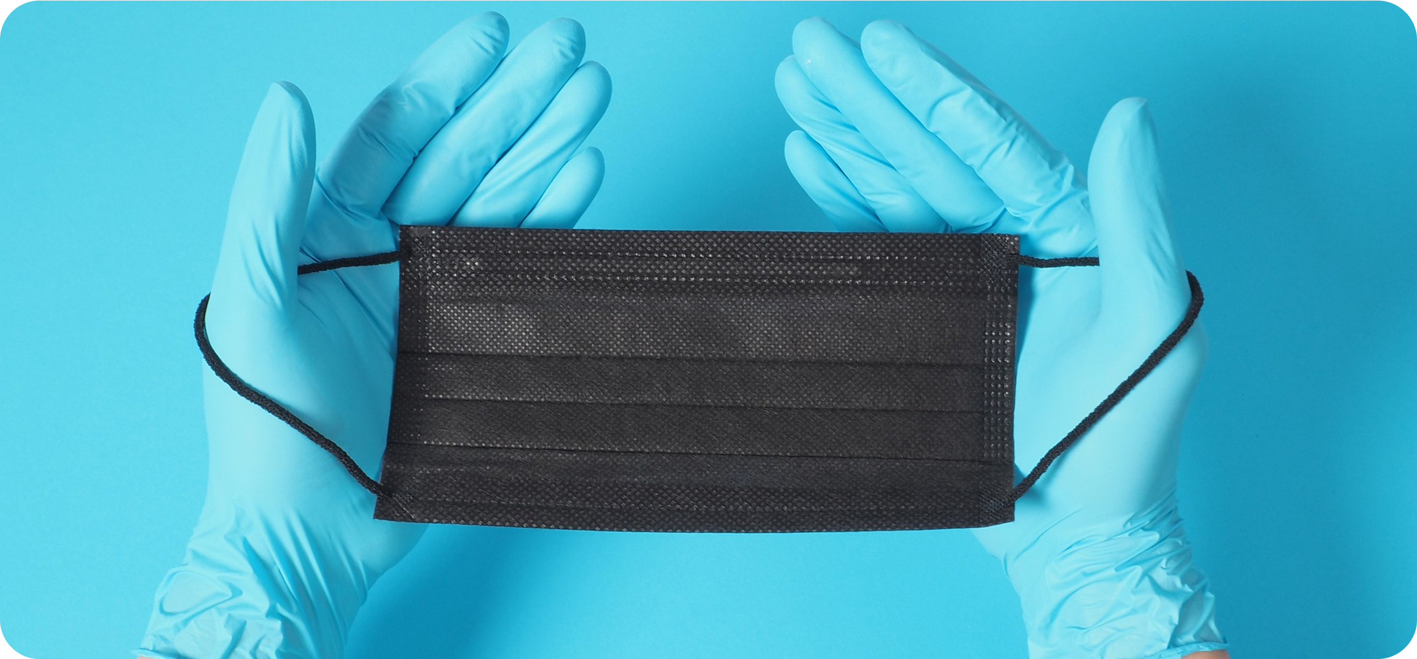 SureSafe brand banner featuring a professional in a medical mask and blue nitrile gloves. Grip Strong. Work Safe.