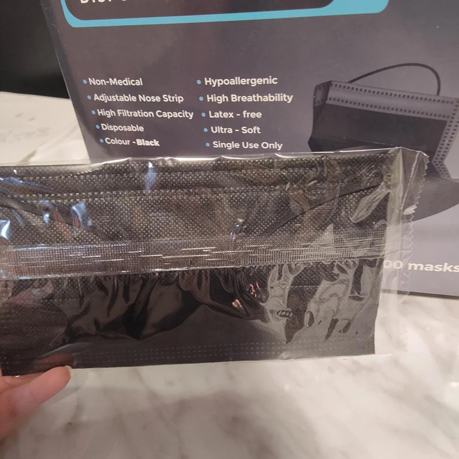 SureSafe premium 3-layer black disposable masks, individually packed for hygiene, 100 count box with adjustable nose strip.