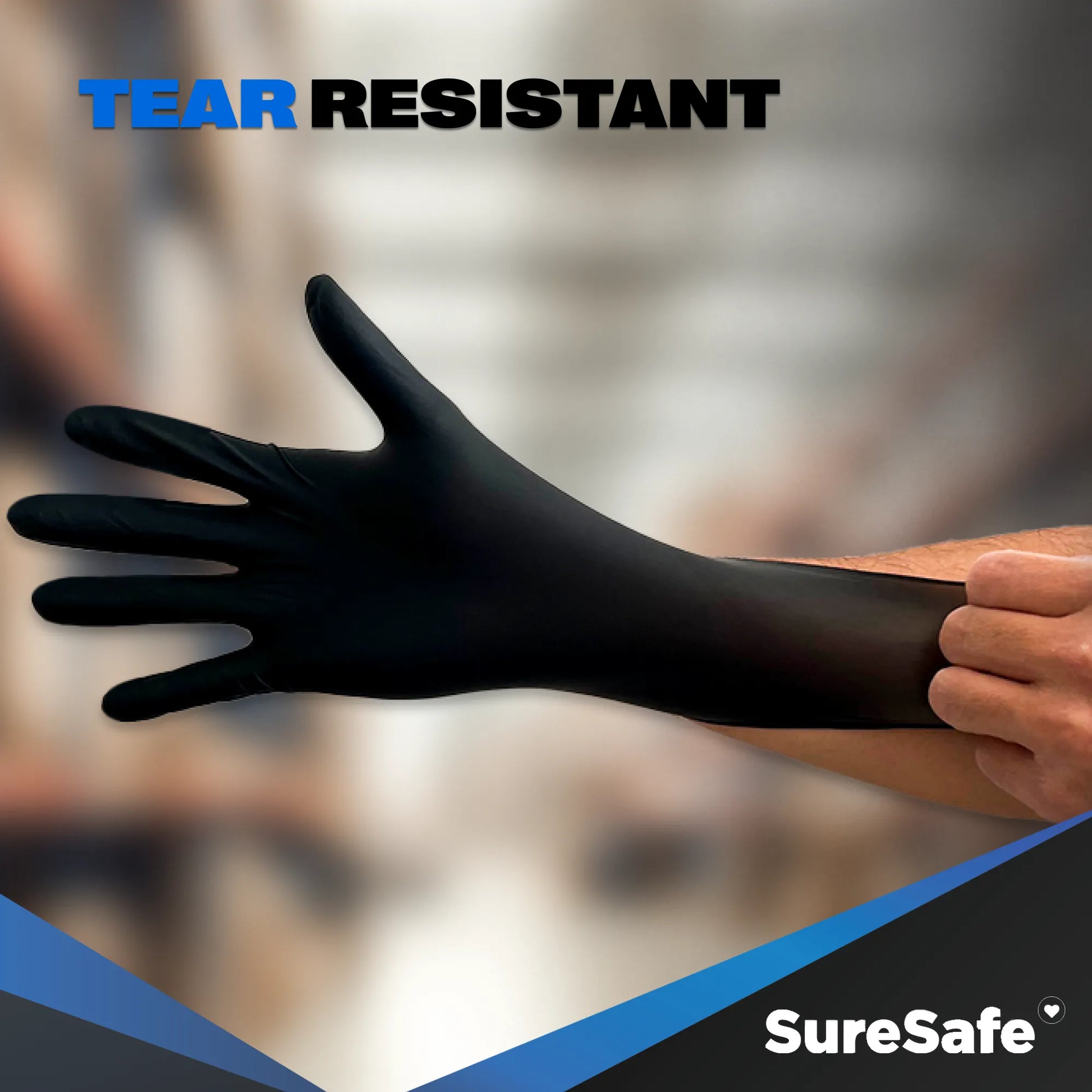 Durable SureSafe OBS6 6 mil black disposable gloves being stretched to demonstrate superior material strength and flex.