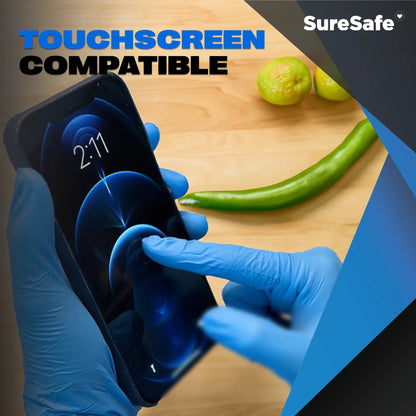 Person wearing blue SureSafe OBS gloves using a smartphone to show touchscreen sensitivity for food and factory workers.